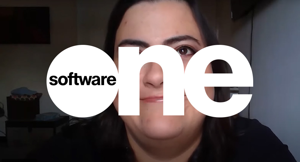 Software one logo with a woman in front of it.