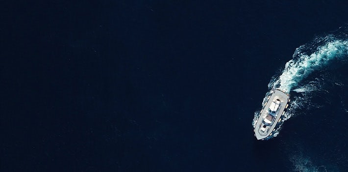 An aerial view of a ship in the ocean.
